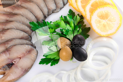 Image of fish with vegetables,anion olives