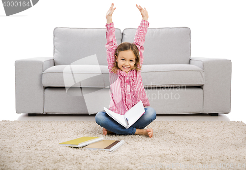 Image of Little girl making homework