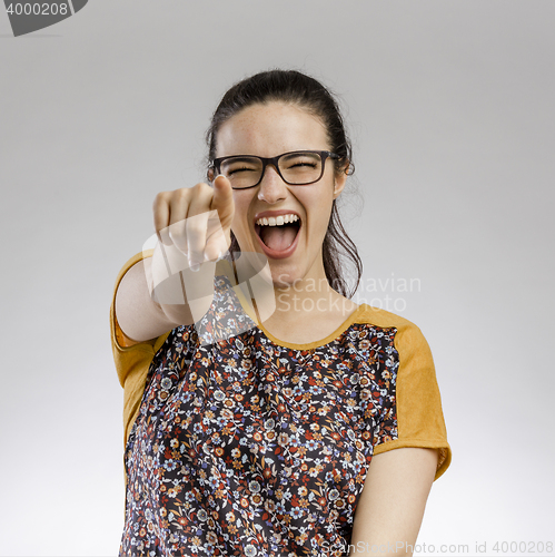 Image of Happy woman pointing