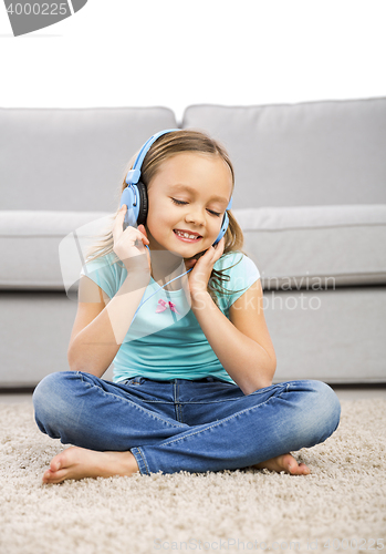 Image of Cute girl listen music