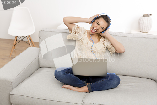 Image of Listen music on her laptop