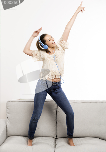 Image of Happy woman dancing 