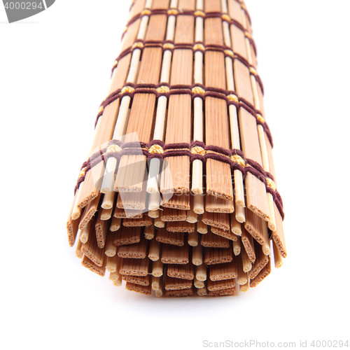 Image of folded bedding wooden tea isolated