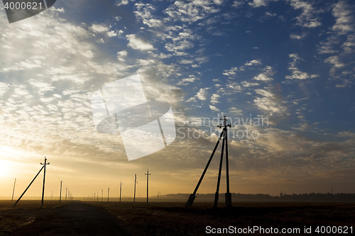 Image of power poles in the field