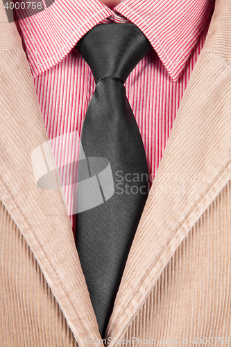 Image of Close-up of red striped shirt with black tie