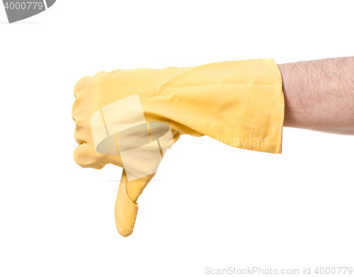 Image of yellow rubber glove of a cleaning lady arm show thumbs down
