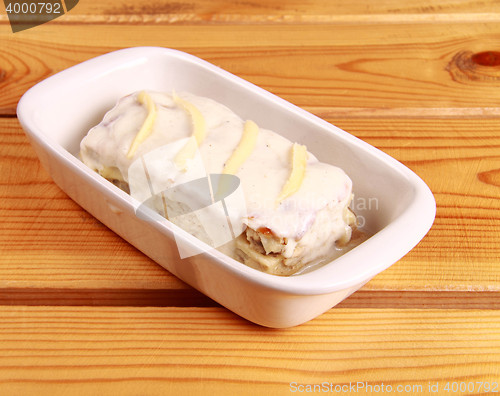 Image of white lasagna isolated on wooden background