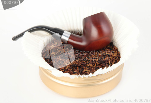 Image of Wooden smoking pipe and tobacco