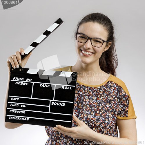Image of Woman with a clapboard