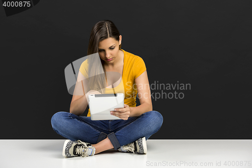 Image of Woman working with a tablet