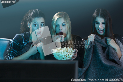 Image of Scared teenage watching movies 