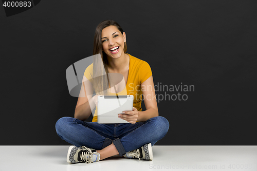 Image of Woman working with a tablet