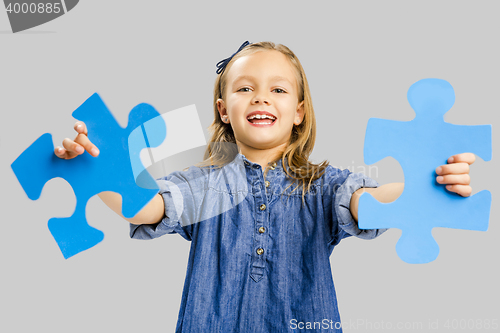 Image of Girl holding a puzzle