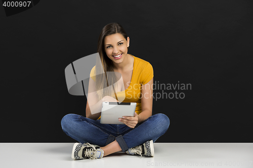 Image of Woman working with a tablet