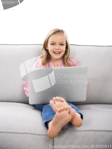 Image of Little girl working with a laptop