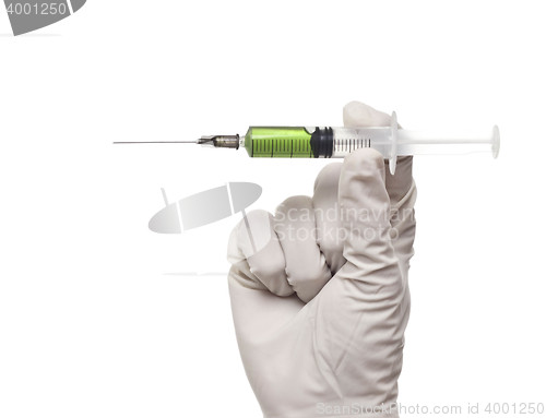 Image of Hand holding syringe isolated on white