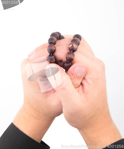 Image of rosary with hands