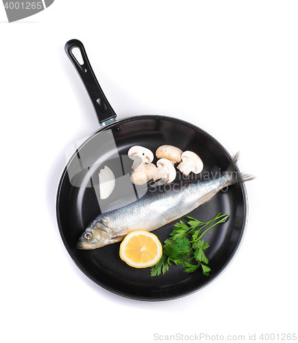 Image of fish in pan with vegetables