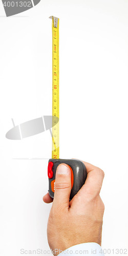 Image of Hand holding a measuring roulette