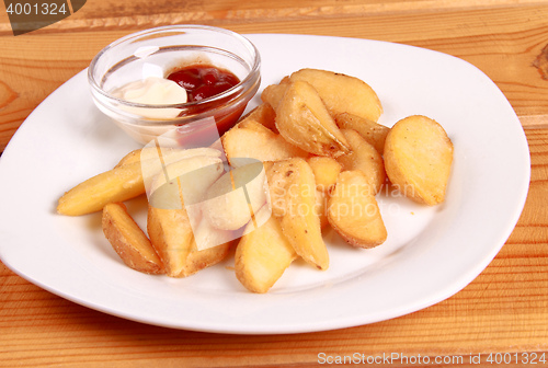 Image of coocked potatot with ketchup isolated