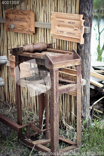 Image of Antique machine for tile production