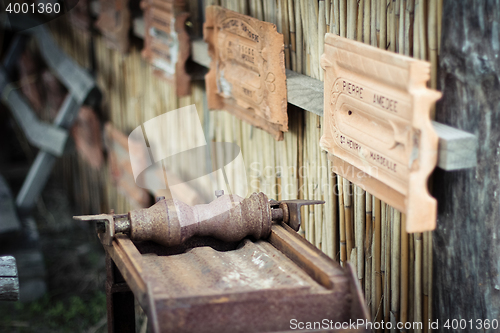 Image of Antique machine for tile production