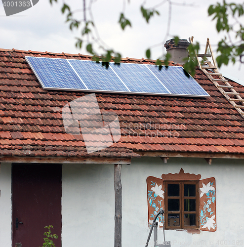 Image of Old antique house with solar panels
