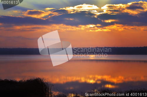 Image of Sunrise over the lake early in the morning with beautiful clouds