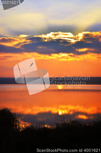 Image of Sunrise over the lake early in the morning with beautiful clouds