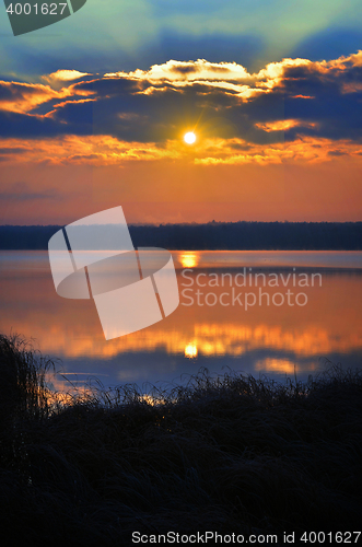 Image of Sunrise over the lake early in the morning with beautiful clouds