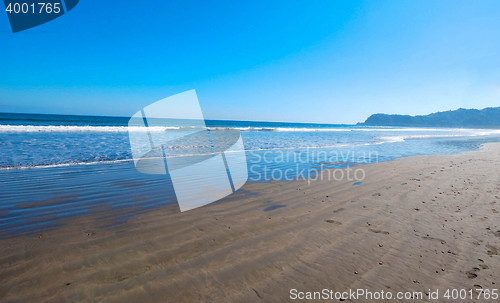 Image of tropical beach with blue sky