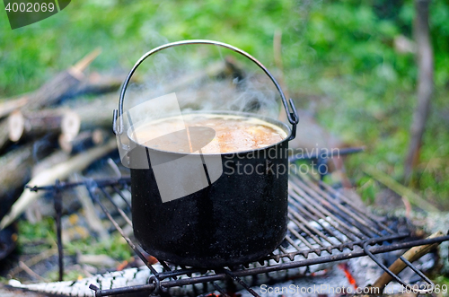 Image of The cooking of soup on the fire