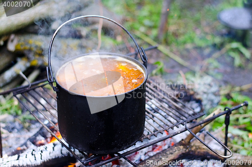 Image of The cooking of soup on the fire