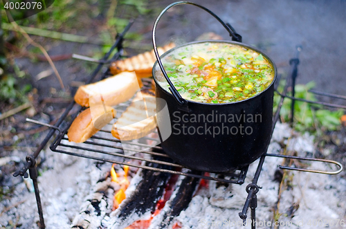 Image of The cooking of soup on the fire