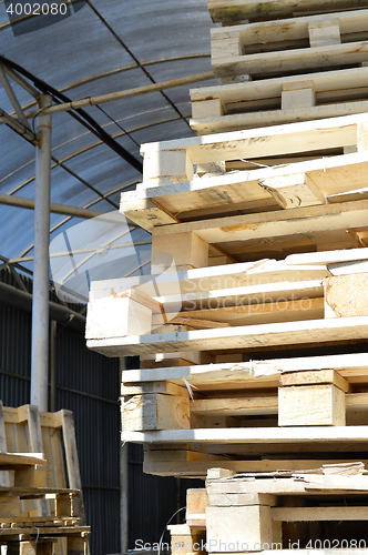 Image of Waste wood from pallets stacked in the storage room