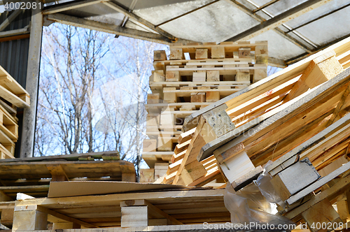 Image of Waste wood from pallets stacked in the storage room