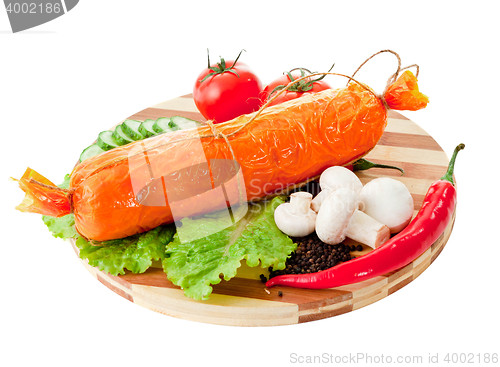 Image of sliced sausage with vegetables and red papper