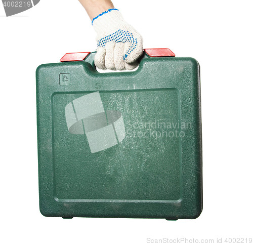 Image of Green tool box in workers hand