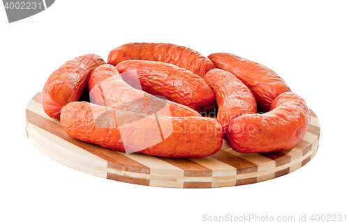 Image of delicious sausages on board