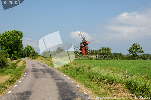 Image of Old windmill by roadside