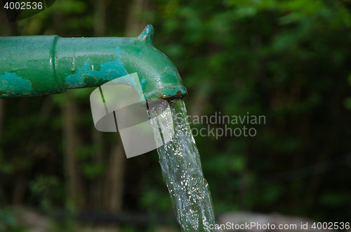 Image of Splashing water from a farm pump