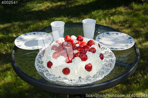 Image of Summer cake at a table