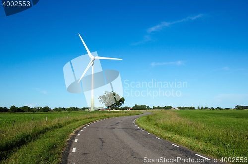Image of Windmill by a country road side