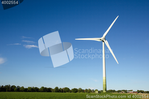 Image of Windmill in a green landscape