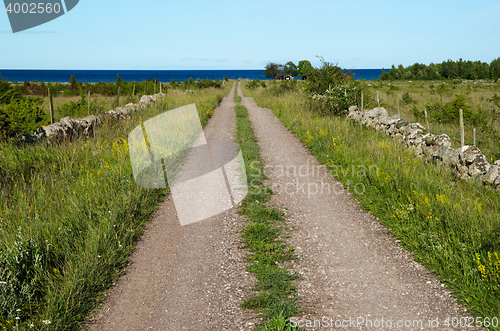 Image of Gravel road straight to the sea