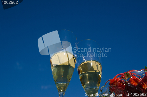 Image of Two glasses champagne and strawberries 