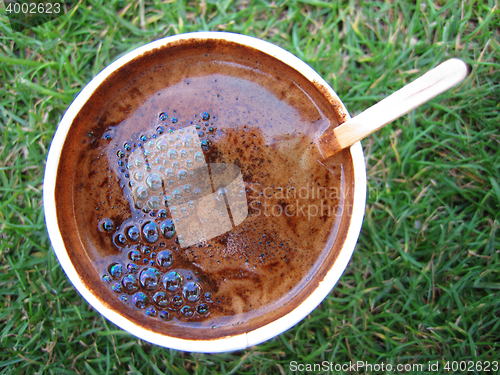 Image of coffee drink in the green grass