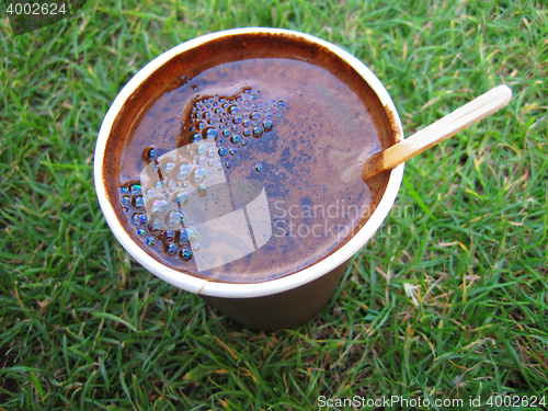 Image of coffee drink in the green grass