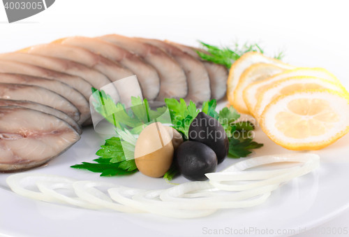 Image of fish with vegetables,anion olives