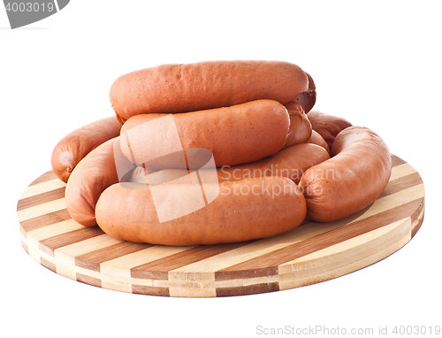 Image of delicious sausages on board